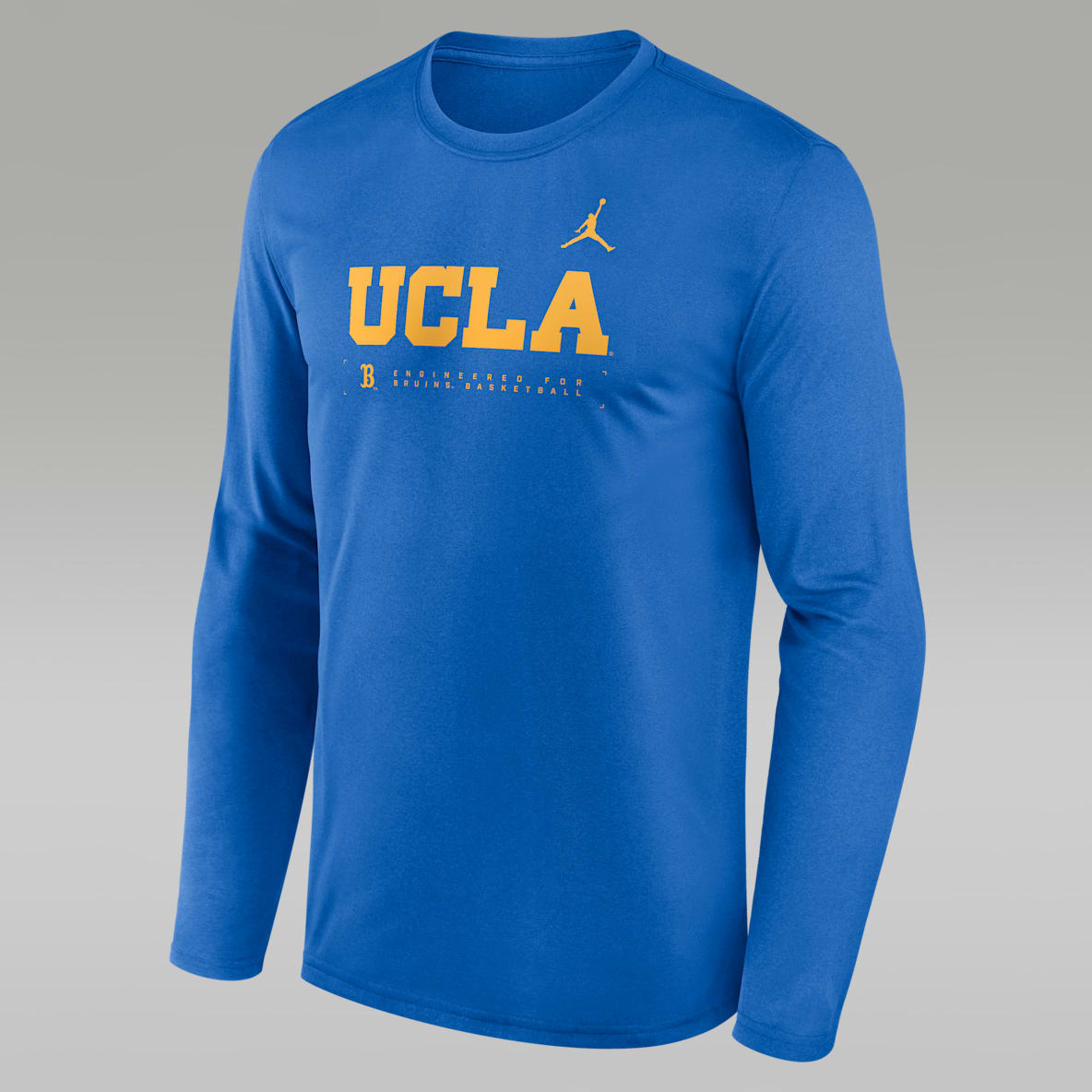UCLA Courtside Basketball Shootaround Legend Playera de manga larga universitaria marca Jordan Dri-FIT para hombre