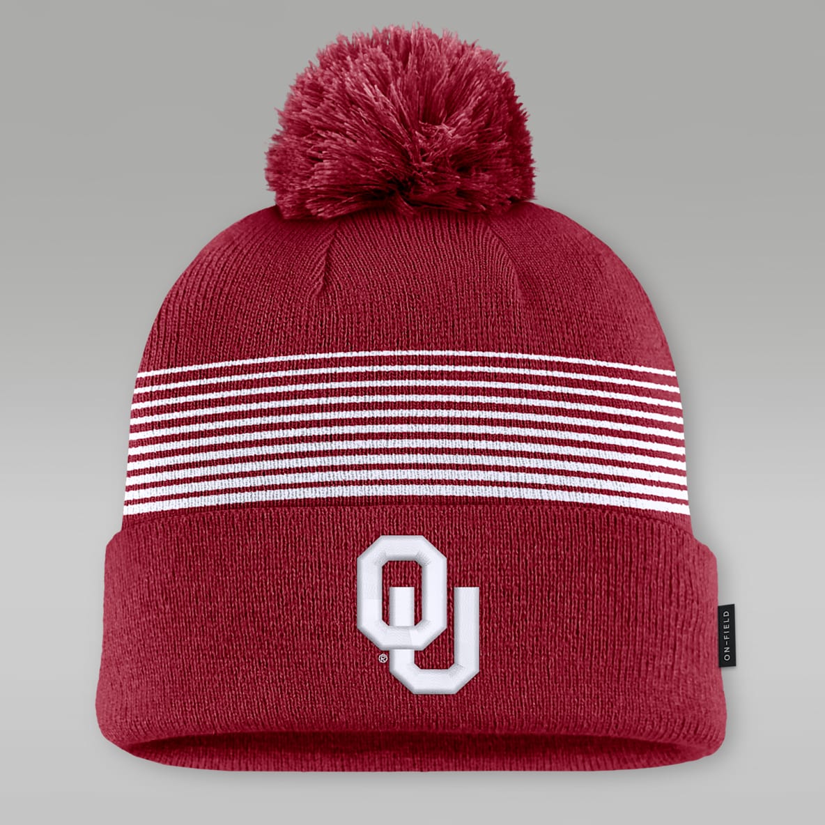 Oklahoma Sideline Peak Gorro universitario con pompón y puño marca Jordan para hombre