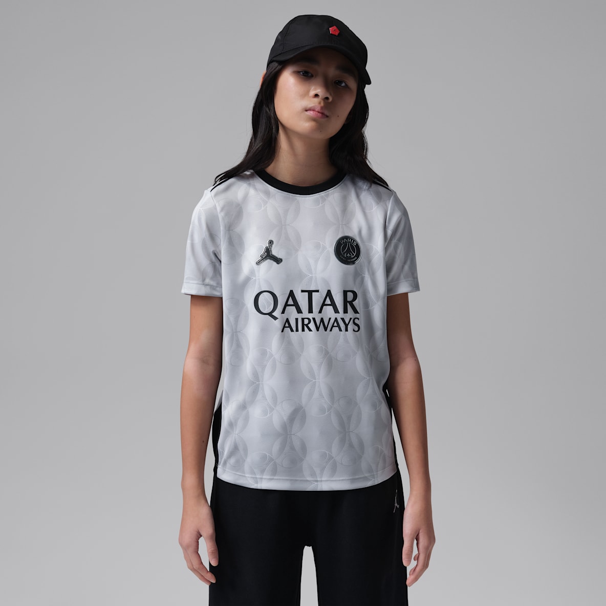 Paris Saint-Germain Academy Pro Night Edition Older Kids' Jordan Dri-FIT Football Short-Sleeve Pre-Match Top