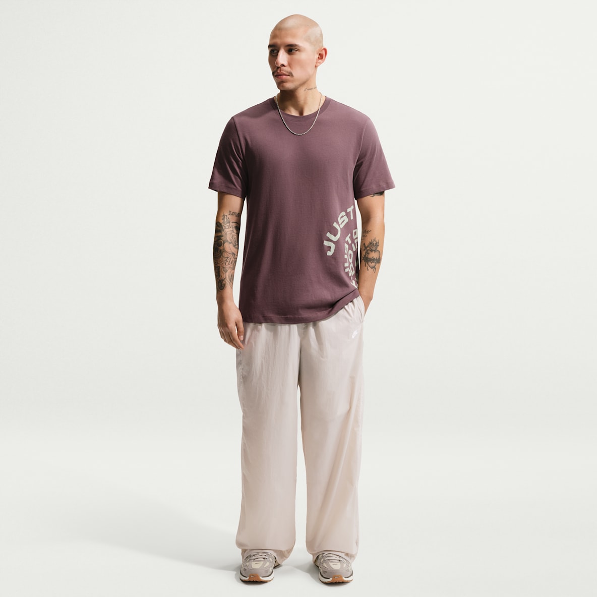 Nike Windrunner Męskie lekkie spodnie z ochroną przed promieniowaniem UV