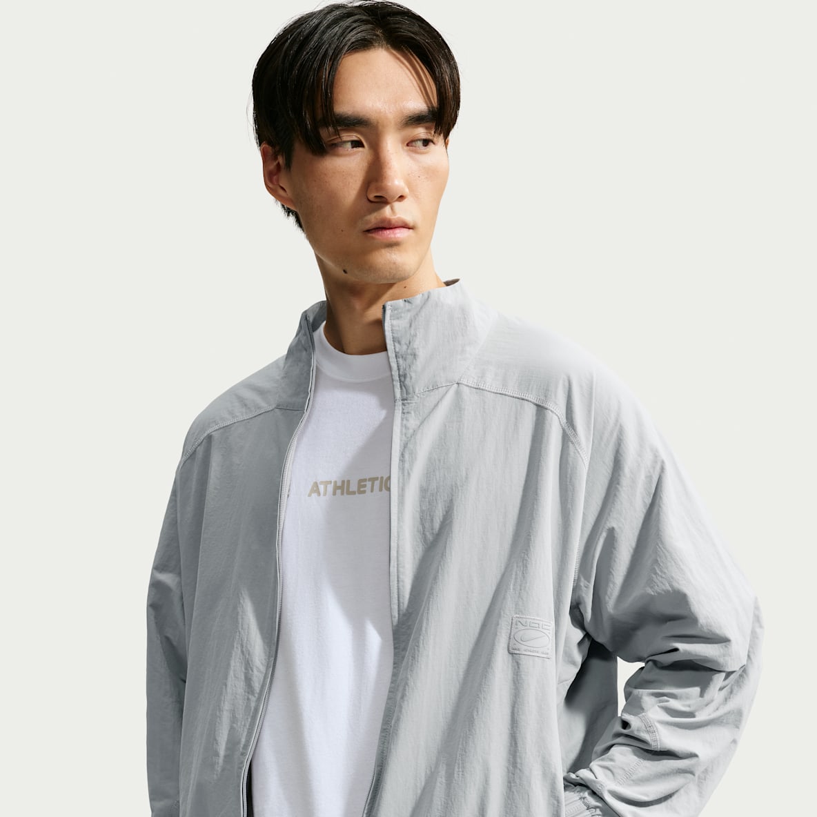 Nike เสื้อแจ็คเก็ตแบบทอซิปยาวขนาดโอเวอร์ไซส์ผู้ชาย Dri-FIT N.A.C.