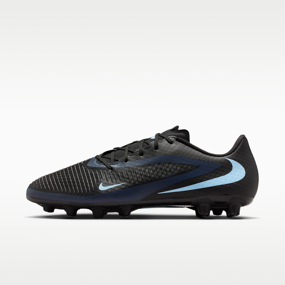 Nike Phantom 6 Low Academy Tacos de fútbol para terreno duro