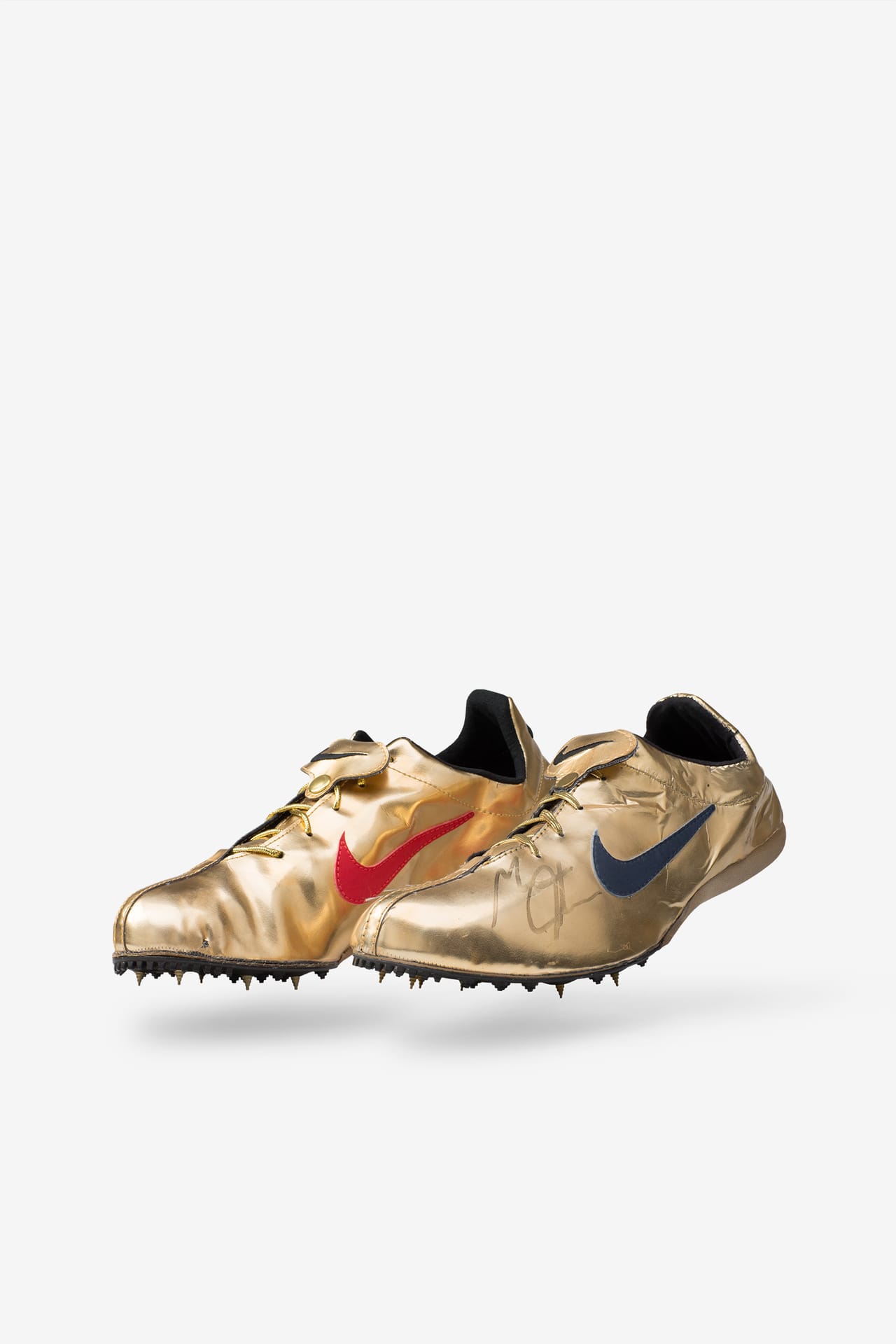 Gold nike spikes online