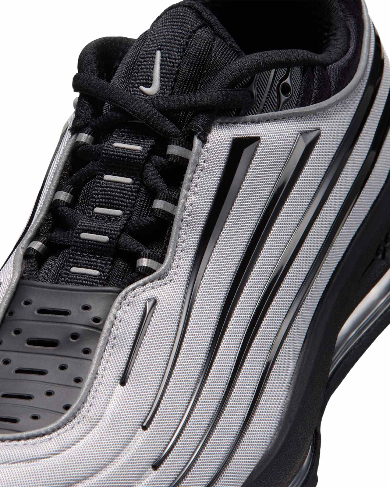 Nike Air Max Ecstasy Plus "Metallic Silver and White" IV7022-001 close-up of the striped upper. Official Nike SNKRS image