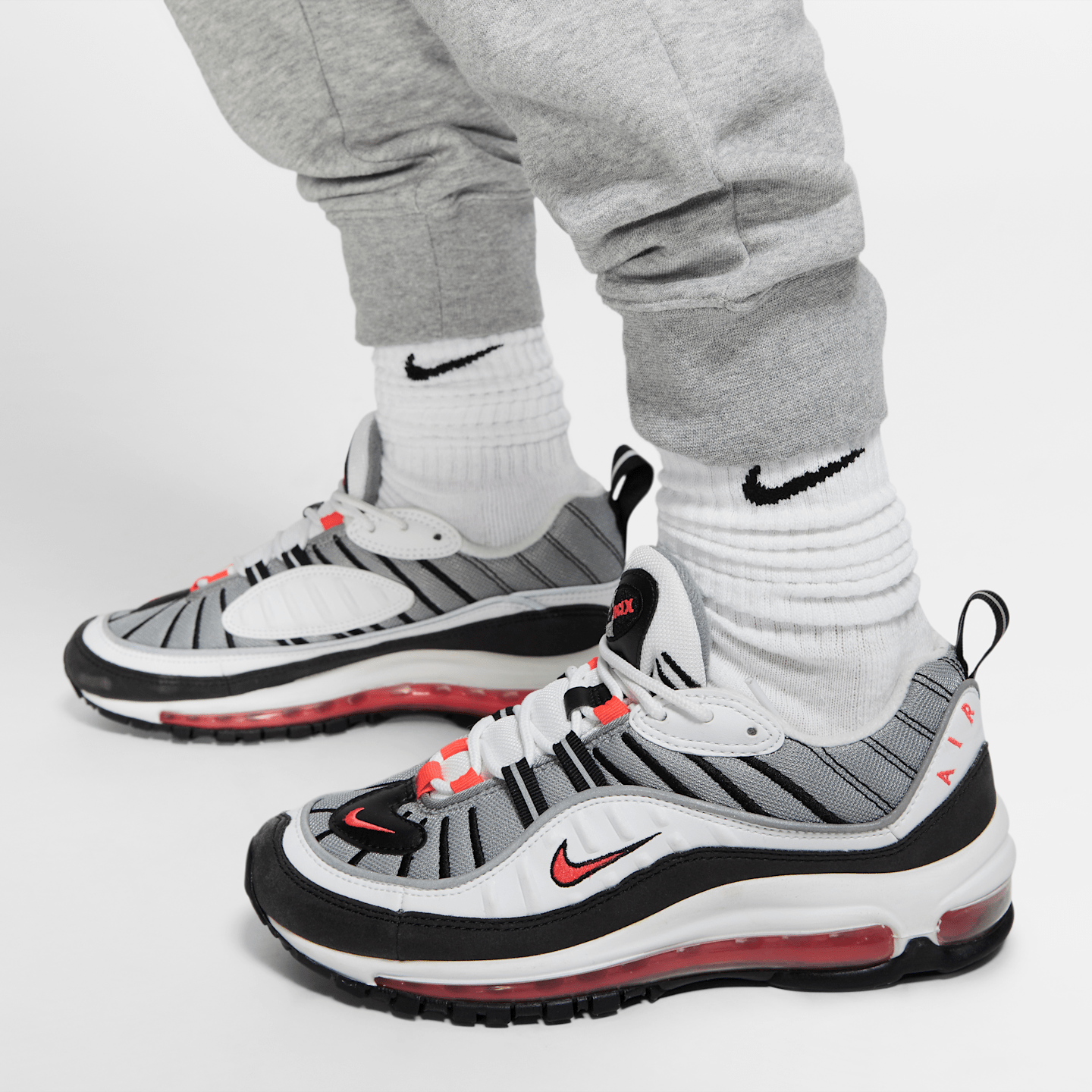 Женские флисовые брюки Nike Sportswear Essential, цвет: Серый меланжевый / Серебряный — фото 4