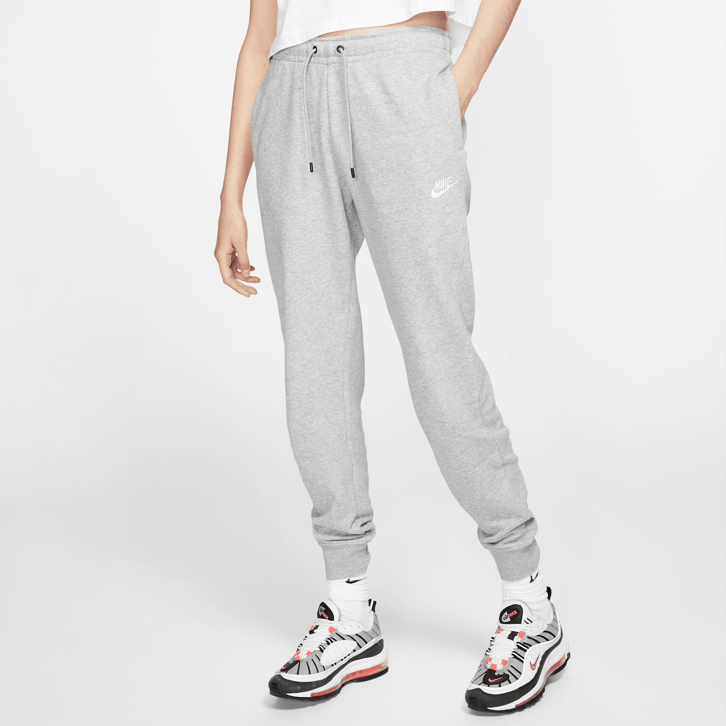 Женские флисовые брюки Nike Sportswear Essential, цвет: Серый меланжевый / Серебряный — фото 1