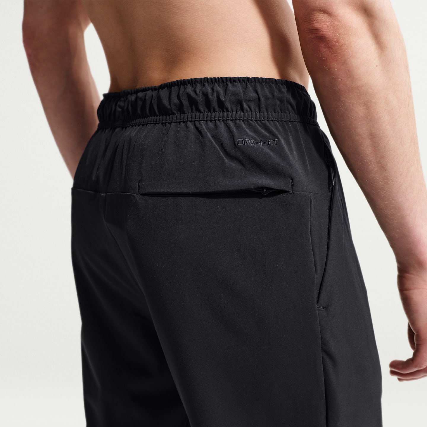 Мужские универсальные брюки Nike Unlimited Dri-FIT с молниями на манжетах, цвет: Чёрный — фото 3