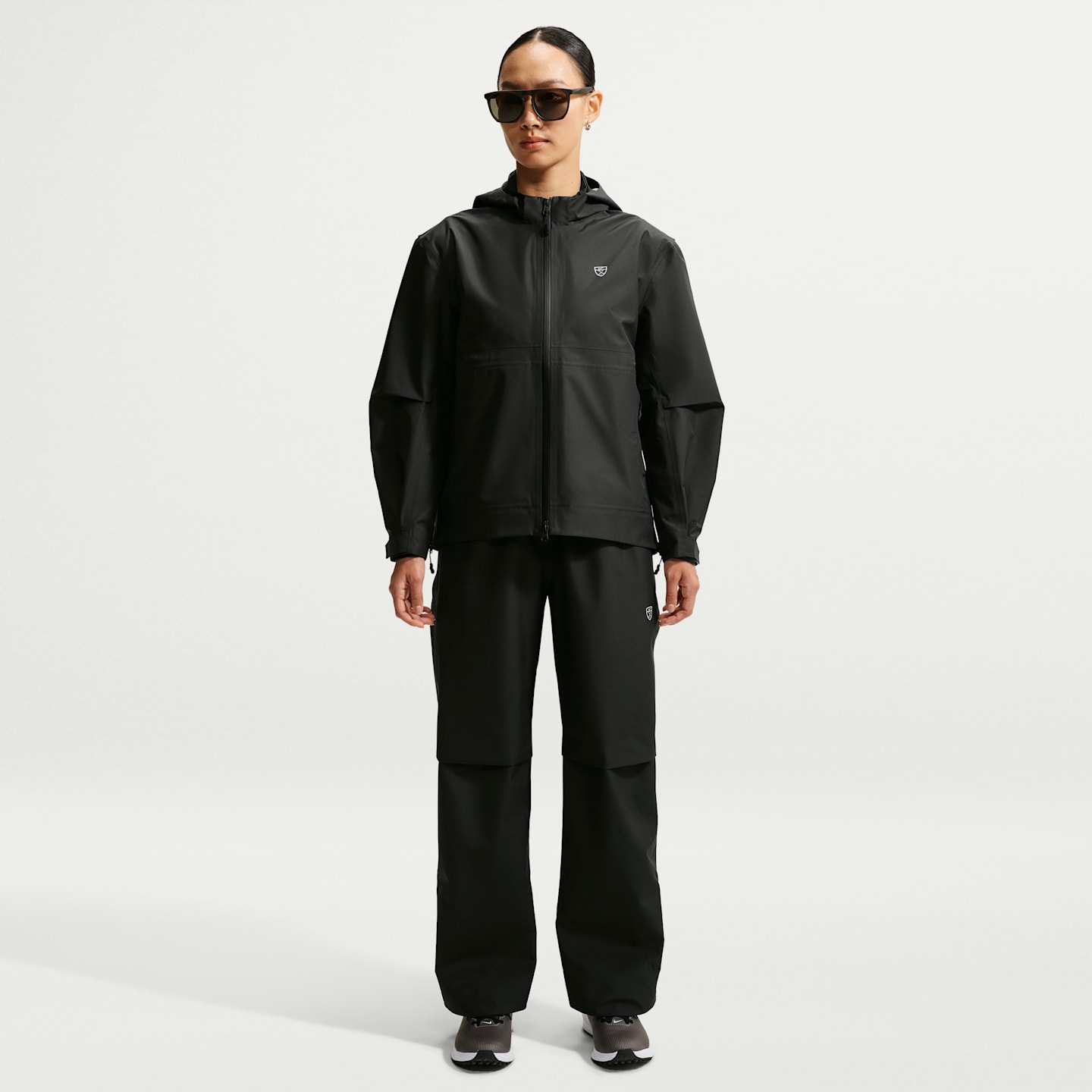 Женские брюки Nike Storm-FIT ADV Golf, цвет: Чёрный / Белый — фото 1