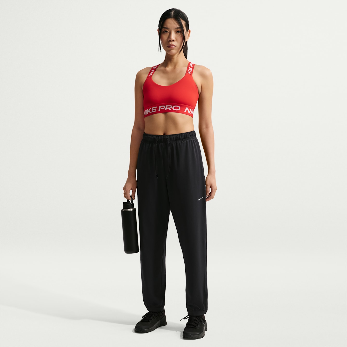 Женские длинные тканые брюки Nike Pro Dri-FIT со средней посадкой, цвет: Чёрный / Белый — фото 1