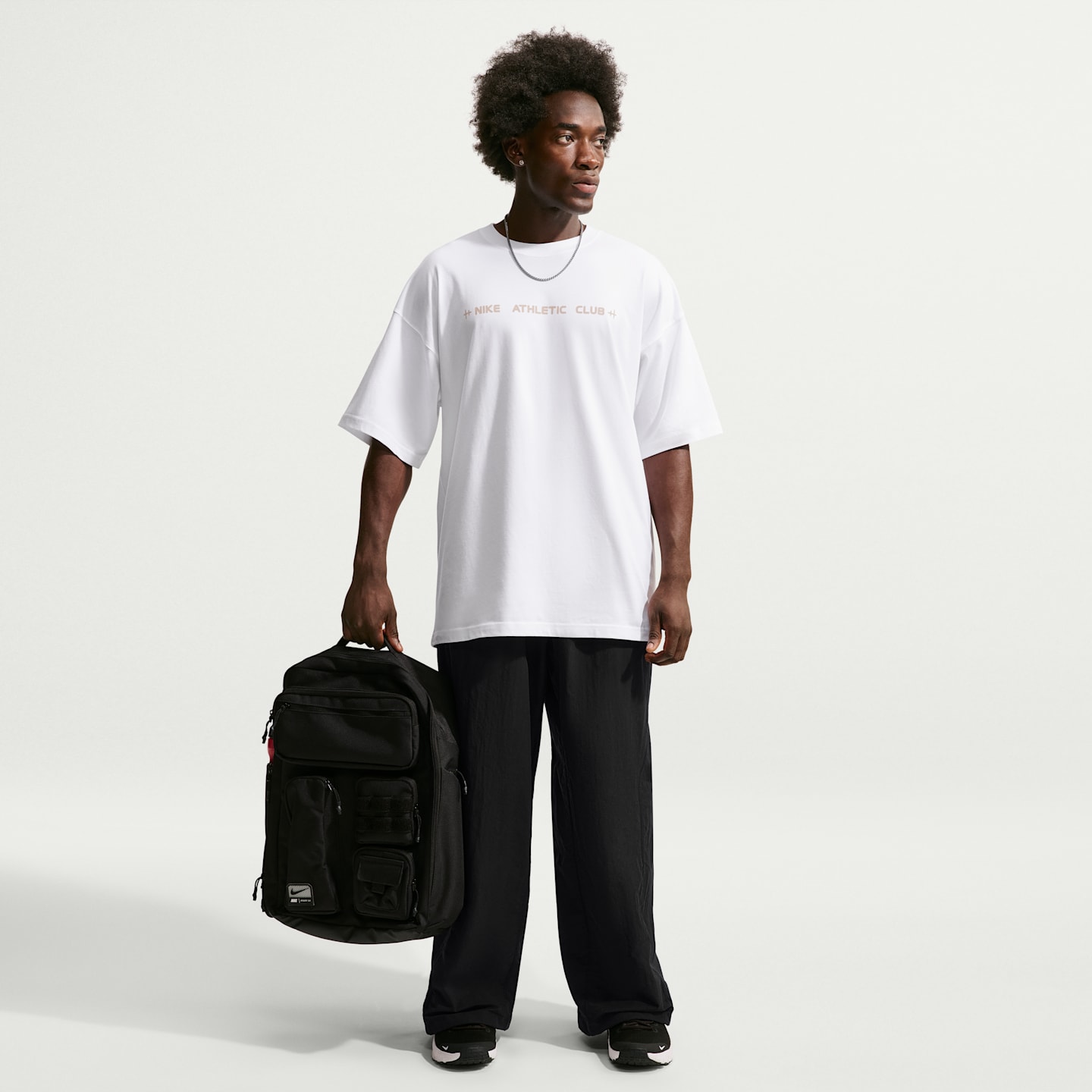 Мужские тканые брюки Nike N.A.C. Dri-FIT оверсайз, цвет: Чёрный — фото 1