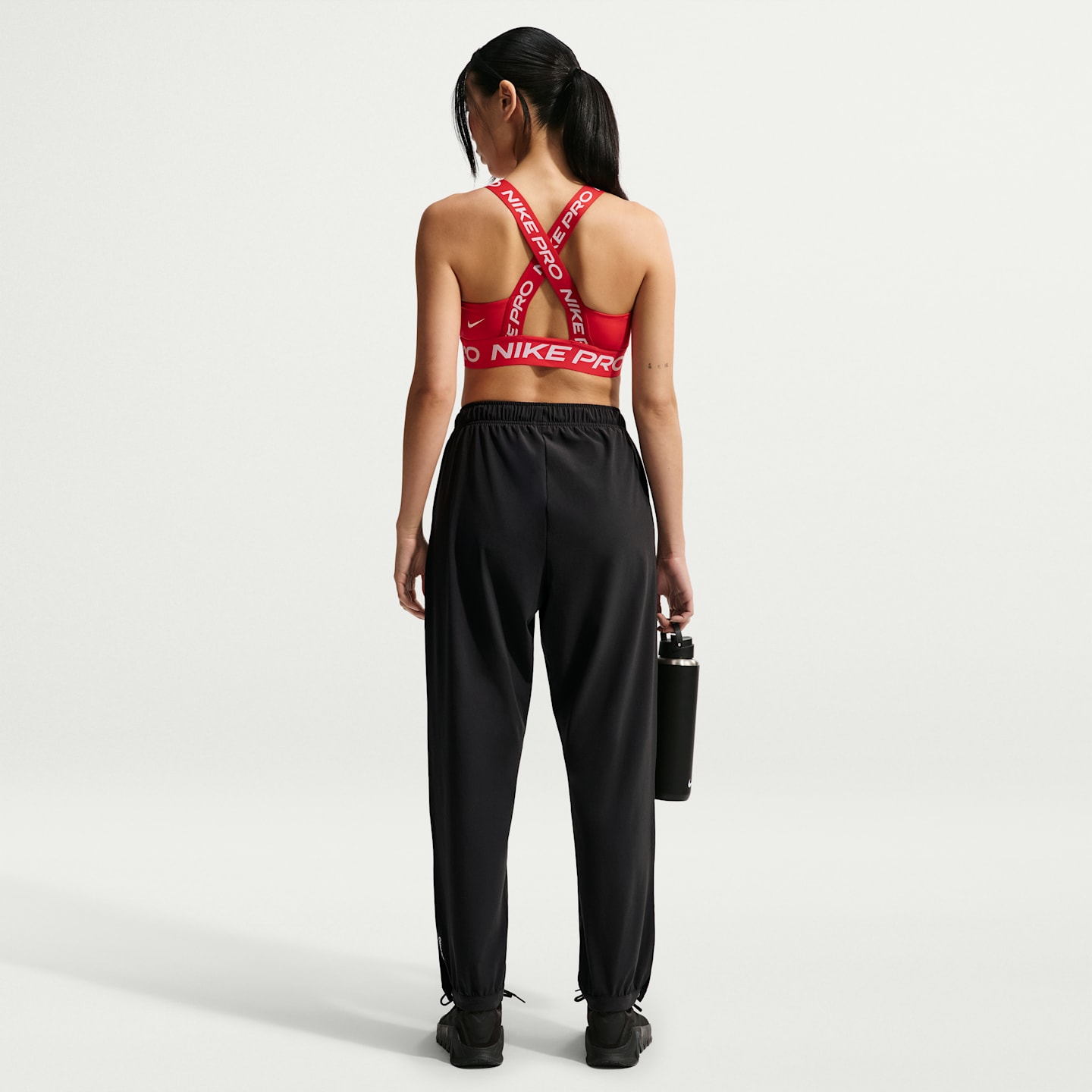 Женские длинные тканые брюки Nike Pro Dri-FIT со средней посадкой, цвет: Чёрный / Белый — фото 5
