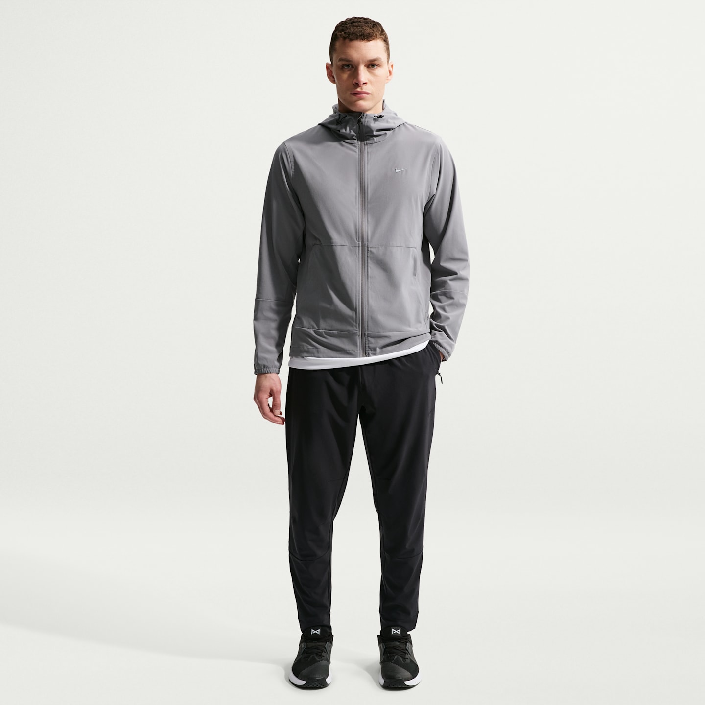 Мужские универсальные брюки Nike Unlimited Dri-FIT с молниями на манжетах, цвет: Чёрный