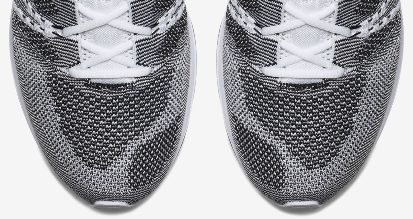 flyknit trainer black white