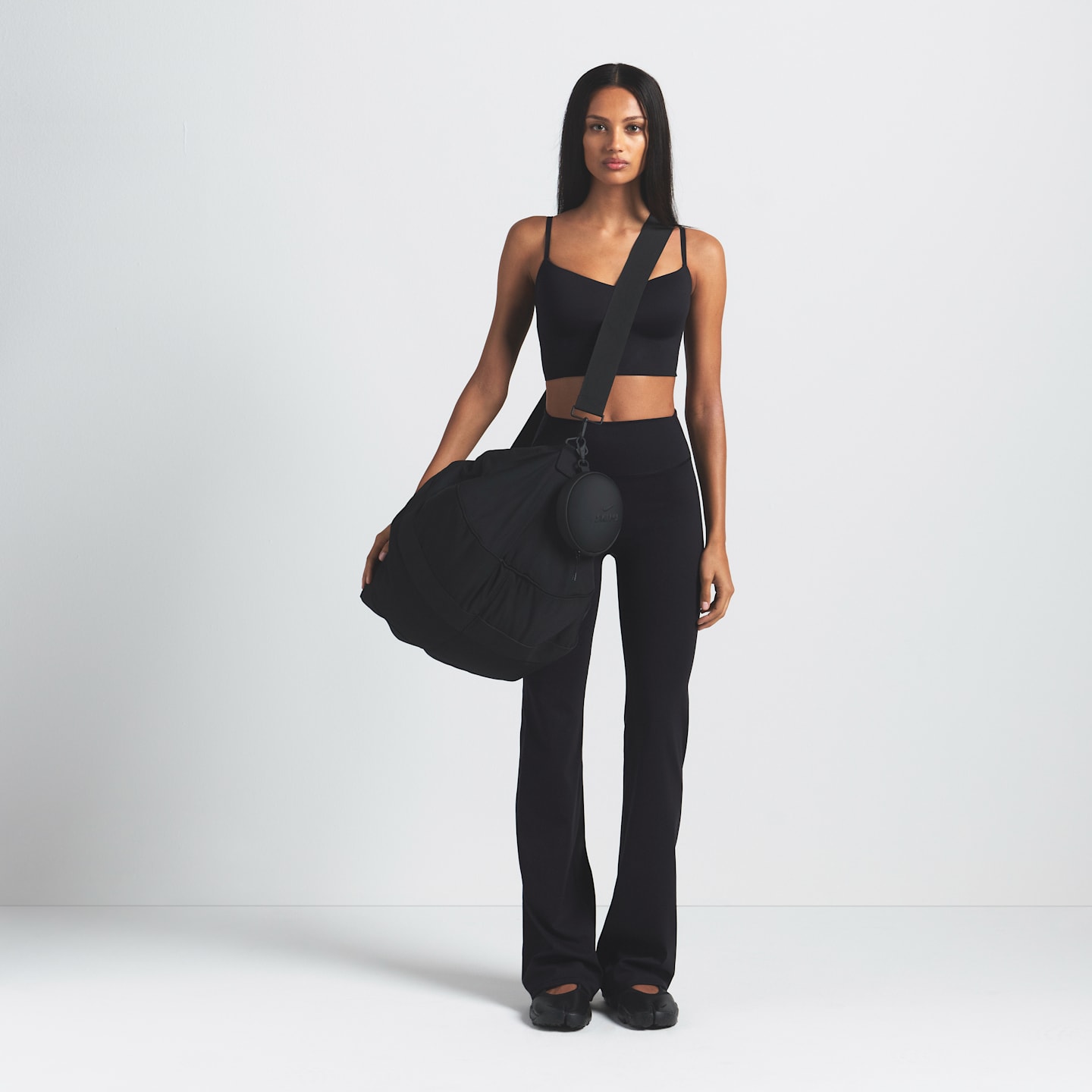 Женские леггинсы Nike NikeSKIMS Matte Women's High-Waisted Slim Flared Leggings — фото 5