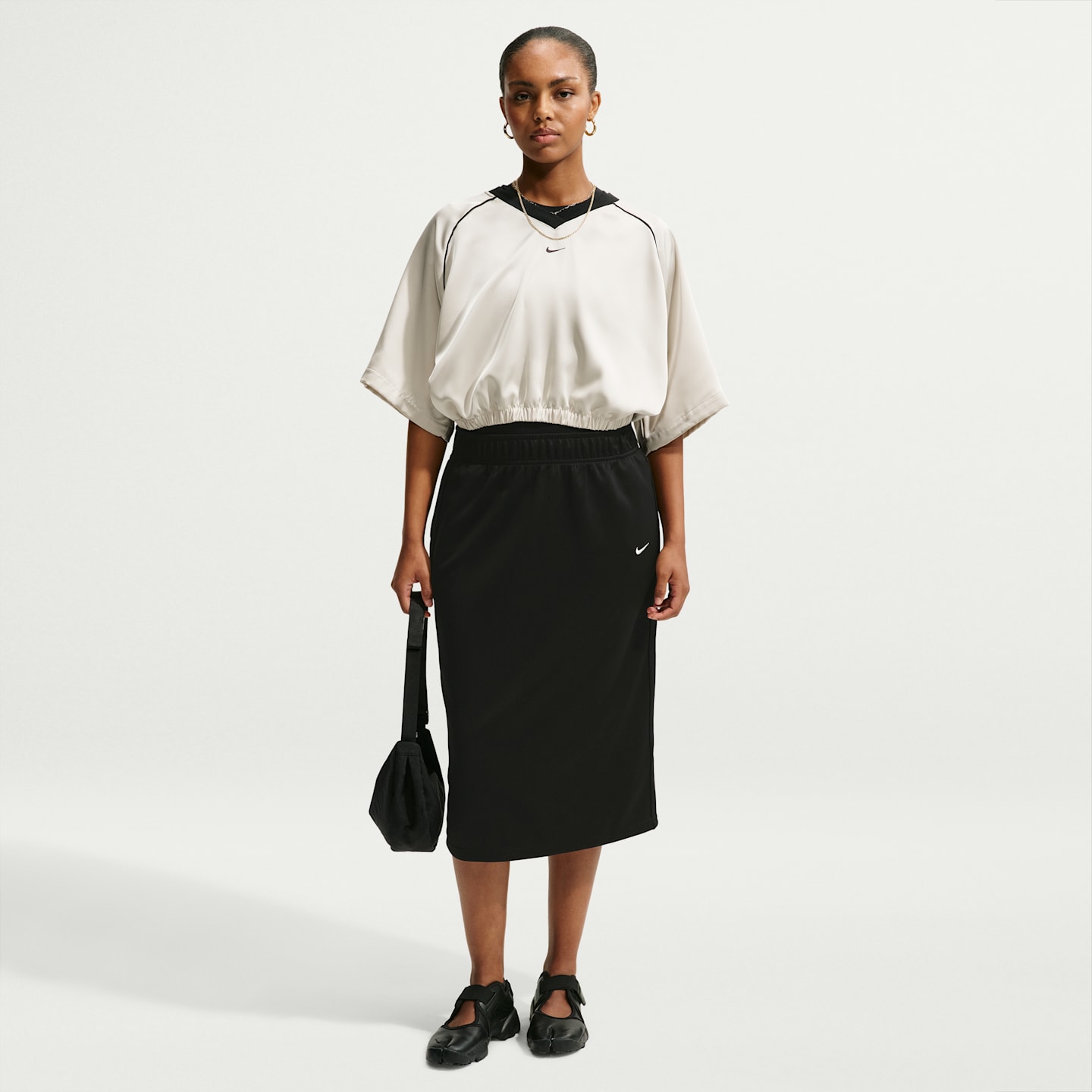 Женские юбки Nike Sportswear Women's Loose Midi Track Skirt — фото 1