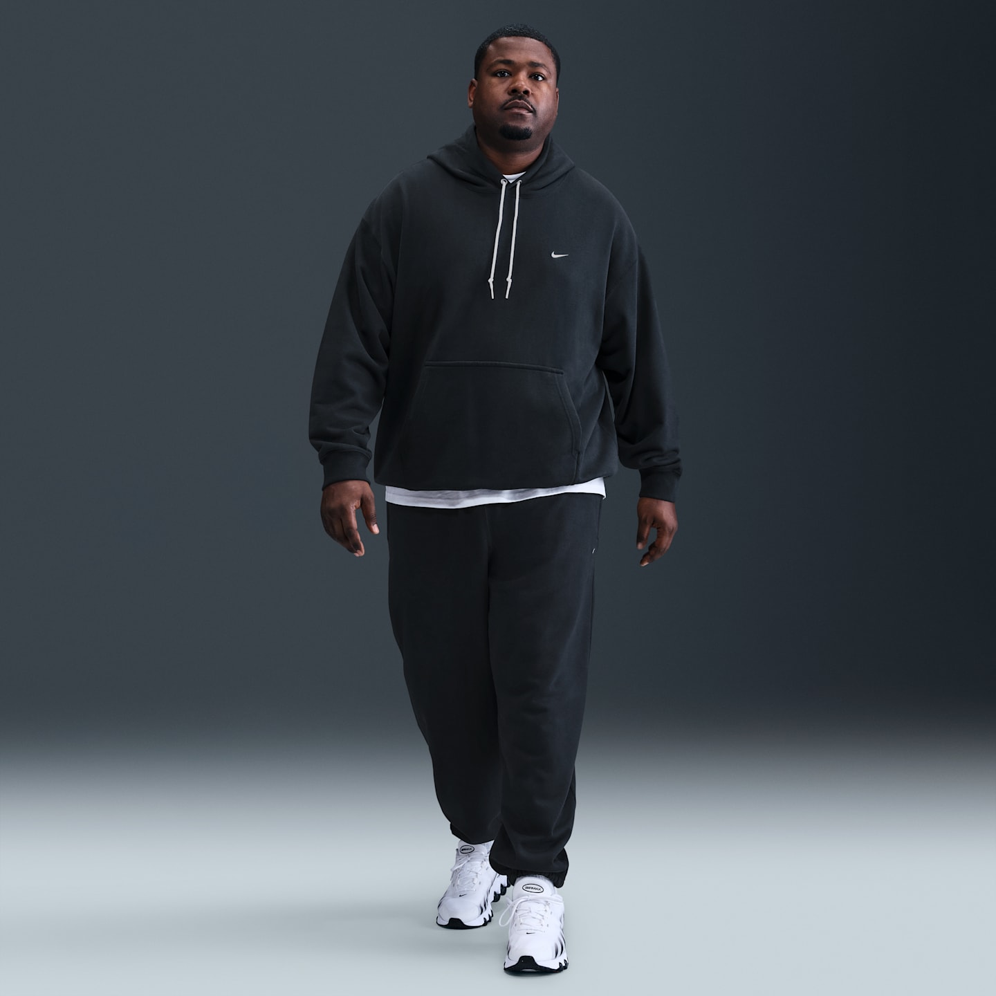 Мужские брюки Nike Solo Swoosh Men's Cuffed Fleece Pants — фото 6