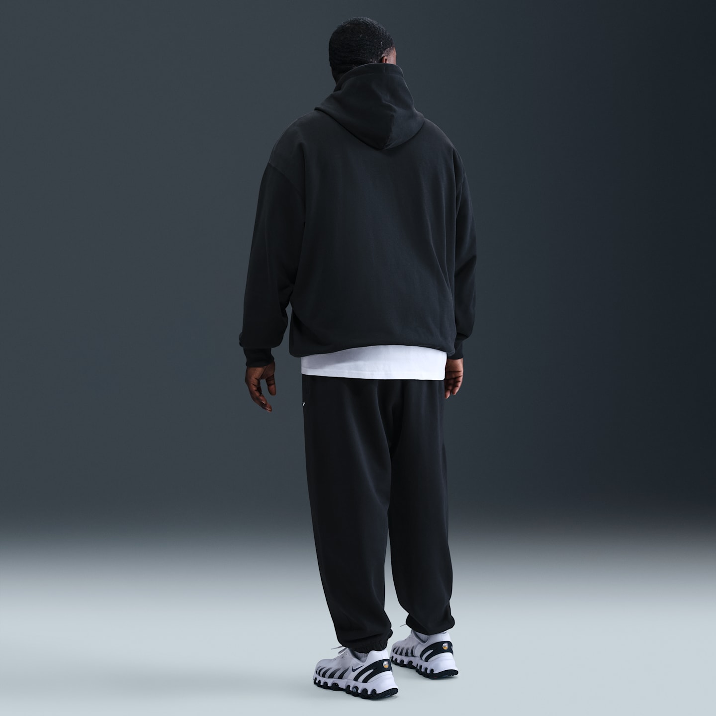 Мужские брюки Nike Solo Swoosh Men's Cuffed Fleece Pants — фото 9