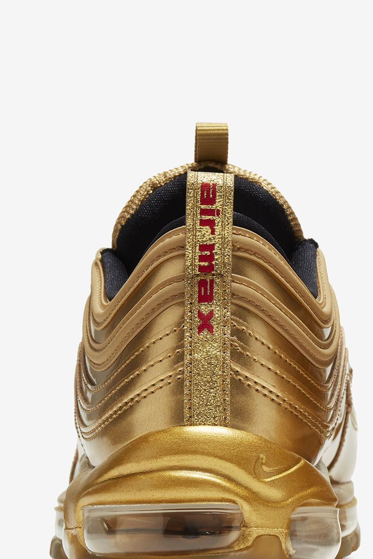 gold nike 97