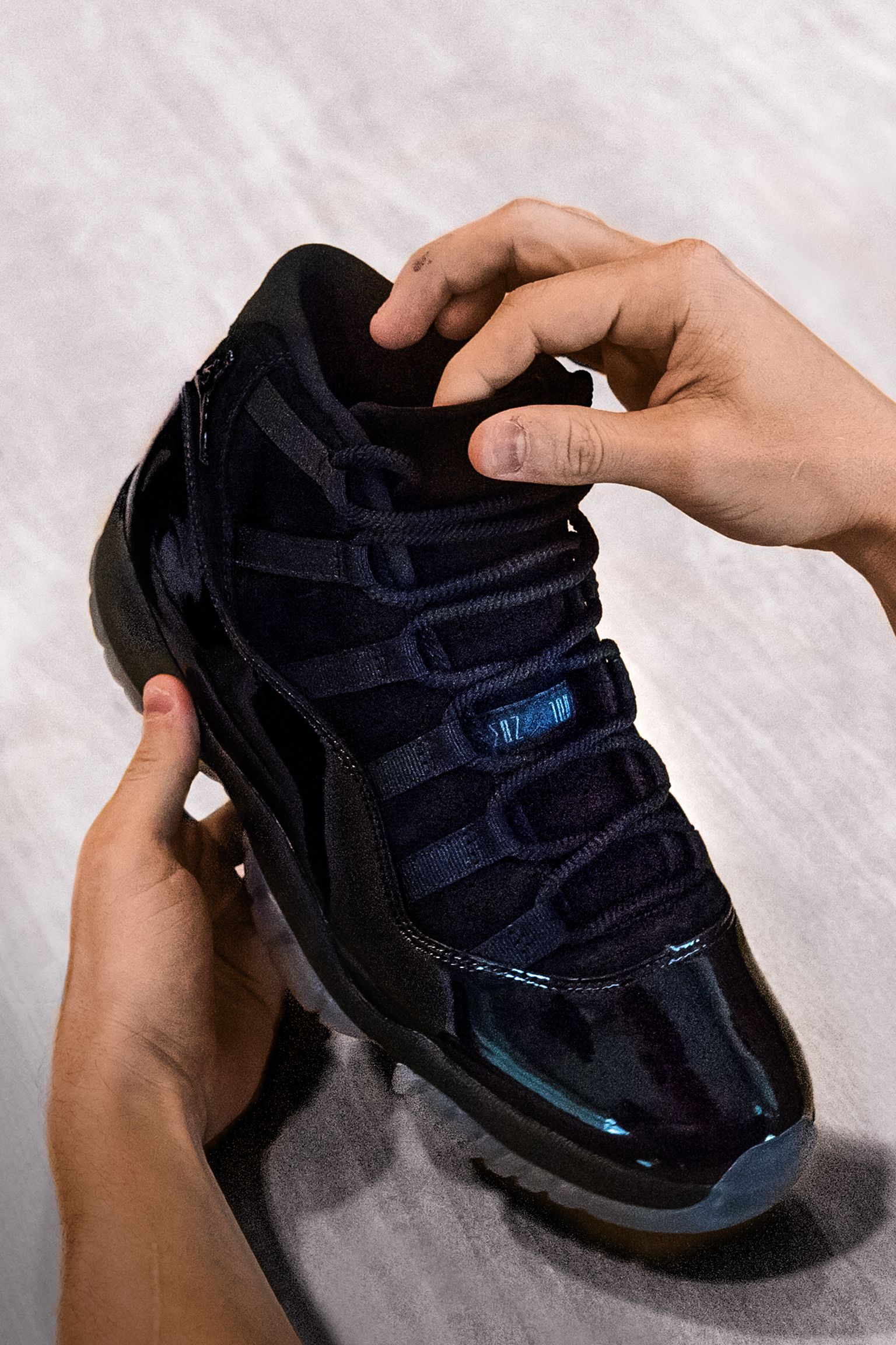 handcuffs touch italic Behind The Design: Air Jordan 11 'Cap and Gown'. Nike SNKRS