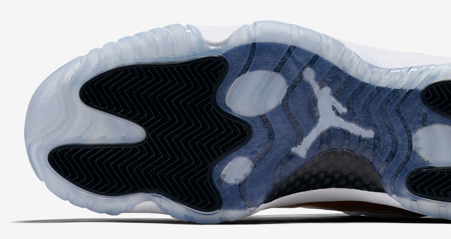 white and gold low top 11s
