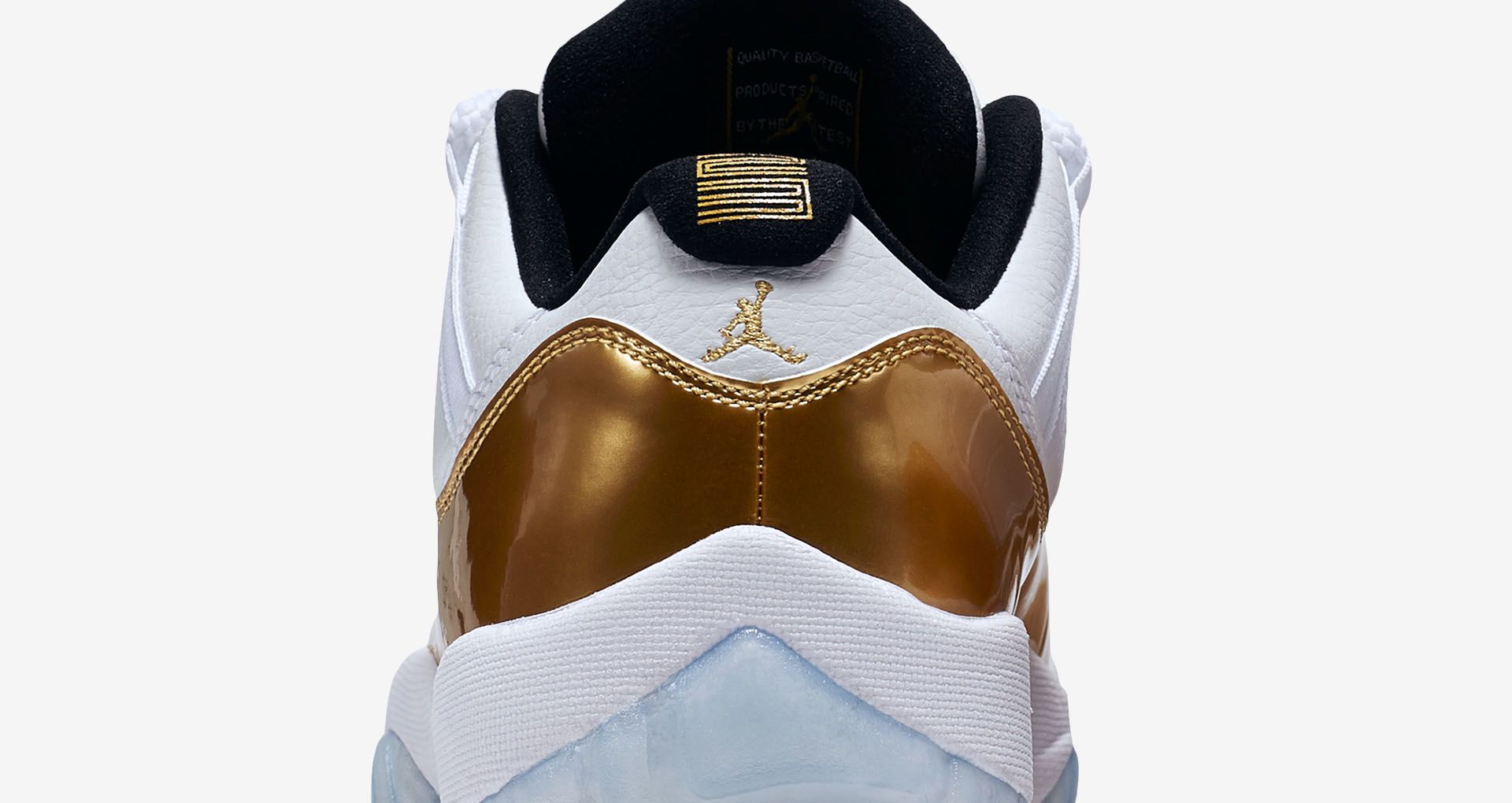 white and gold low top 11s
