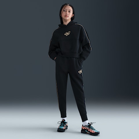 Брюки Nike Sportswear Club Fleece Oversized Joggers для девочек, цвет: Чёрный / Металлик золотой