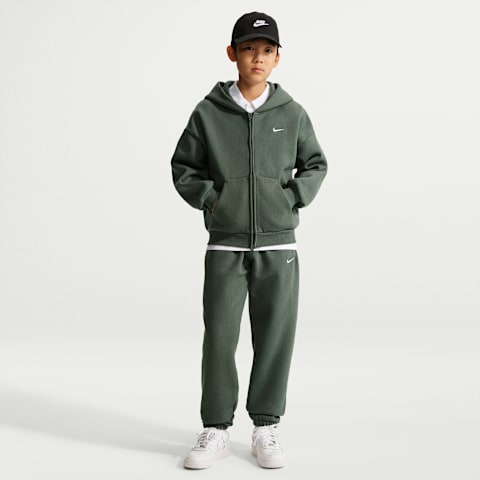 Детские флисовые брюки Nike Solo Swoosh с манжетами, цвет: Камуфляжный зелёный / Молочный