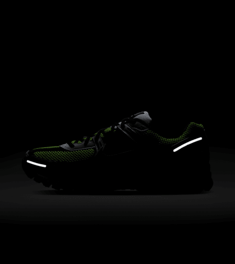 Left lateral view of the reflective elements on the Nike Zoom Vomero 5 low-top running shoe.