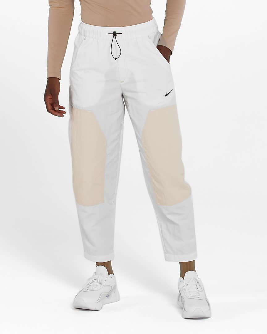 abrazo Accesorios Transición Pants de tejido Woven de tiro alto para mujer Nike Sportswear Swoosh. Nike .com
