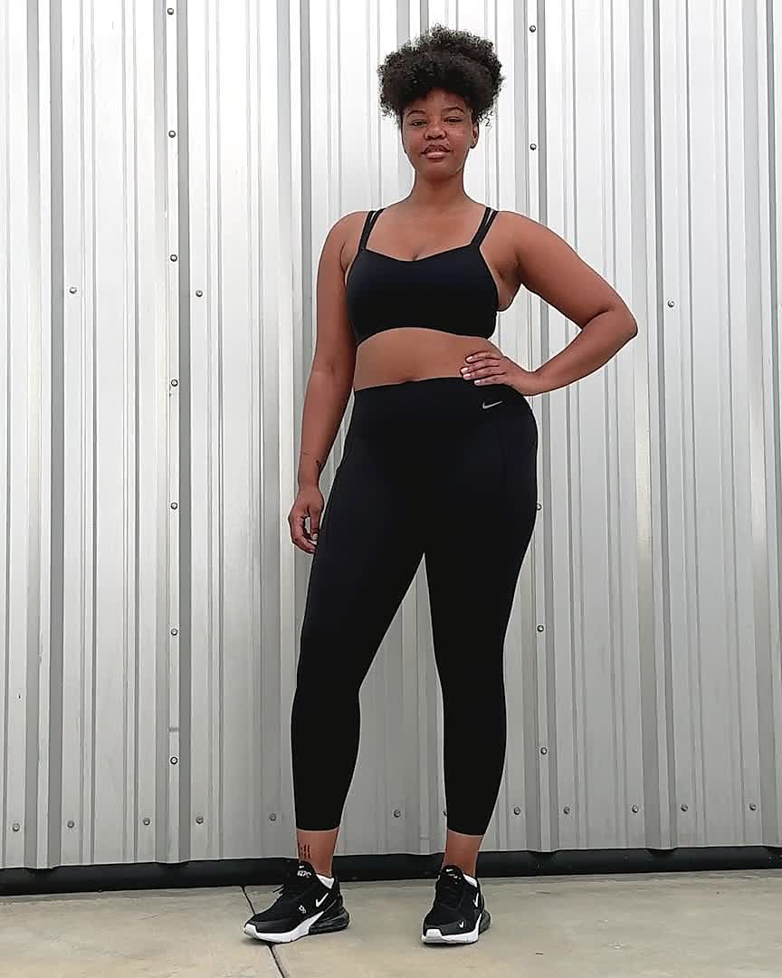 Nike Universa 7/8-legging met halfhoge taille, zakken en medium  ondersteuning voor dames. Nike BE